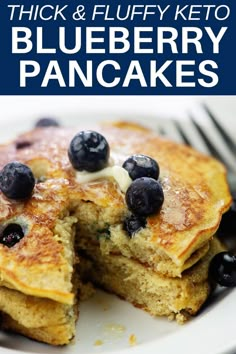 blueberry keto pancakes on a white plate with a fork