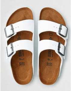 American Eagle Birkenstock Arizona Sandal Classic Slides With Buckle Closure, Classic Slides With Buckle Closure For Spring, Classic Beach Slides With Buckle Closure, Classic Summer Slides With Adjustable Strap, Classic Slides With Adjustable Strap For Summer, Classic Adjustable Slides With Leather Footbed, Classic White Footbed Sandals With Cork-bed Midsoles, Classic Footbed Sandals With Double Strap And Adjustable Fit, White Double Strap Classic Sandals