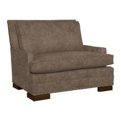 a brown chair with studding on the legs