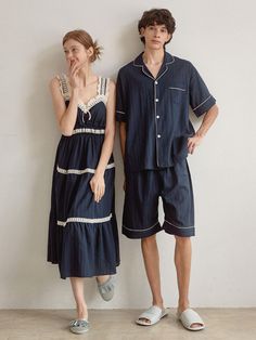 Couple pajamas set in soft cotton fabric. Man's contrast piped trimming short-sleeved shirt with a resort collar, buttons at front, gently dropped shoulders, and an open chest pocket. Shorts with covered elastic at waistband. Woman's nightgown in calf-length, lace-trimmed sweetheart neckline and shoulder straps, and gathered tiers. Unlined.- Couple pajamas- A-line- Midi- Sleeveless Summer Pajama Party Sleepwear With Pockets, Summer Pajama Shorts With Pockets For Pajama Party, Summer Nightgown For Pajama Party With Relaxed Fit, Relaxed Fit Summer Nightgown For Pajama Party, Summer Short Sleeve Nightgown For Pajama Party, Summer Pajama Shorts With Pockets For Sleep, Summer Relaxed Fit Pajama Shorts For Home, Blue Summer Sleepwear For Home, Collared Cotton Sleepwear For Home