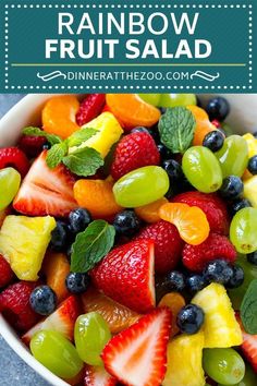 a white bowl filled with fruit salad on top of a table