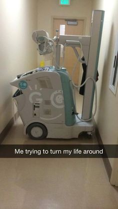 a hospital room with a machine in the hallway next to it that says, me trying to turn my life around