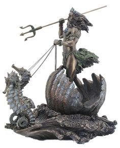 a statue of a woman holding a spear and standing on top of a sea shell