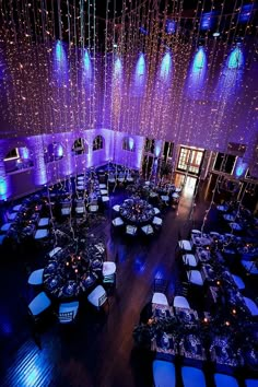 an overhead view of a banquet hall with blue lighting