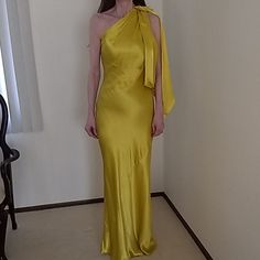 Stunning Evening Or Special Occasion Dress By Zara. It Is A Gorgeous Yellowish/ Gold Shade And Zips On The Side. The Dress Has A Beautiful Knotted Draping On The Left Side. This Dress Will Definitely Make Heads Turn. It Is New With Ticket. Yellow Satin Midi Dress For Party, Elegant Yellow Satin Midi Dress, Yellow Silk Evening Maxi Dress, Yellow Sheath Midi Dress For Party, Yellow Sheath Dress For Parties, Fitted Yellow Evening Dress, Yellow One-shoulder Evening Midi Dress, Yellow One-shoulder Midi Dress For Evening, Yellow One-shoulder Fitted Maxi Dress