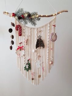 a mobile with christmas decorations hanging from it's sides