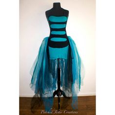 a mannequin with blue and black tulle skirt on it's torso