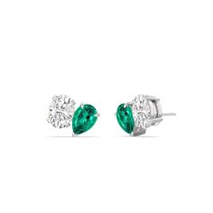 Truly brilliant, these two-stone stud earrings can enhance your style in an instant. They're a good alternative to basic solitaire studs, perfect for when you want to add a bit more glitter and glamour to your looks while still keeping an understated look. The earrings feature an oval diamond and created Emerald pear mounted on an angle, side-by-side, for an edgier style. Blue Wedding Band, Gorgeous Engagement Ring, Solitaire Studs, Diamond Anniversary Rings, Stone Studs, Diamond Stud Earrings, Diamond Stud, Fine Jewelry Gift, Earrings Collection