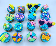 cupcakes decorated with different designs and colors