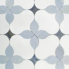 a white and grey tile with circles on it