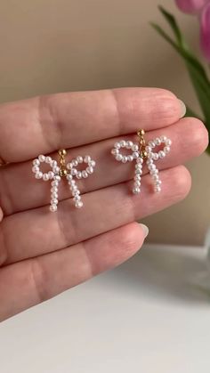 the small cross earrings are adorned with pearls