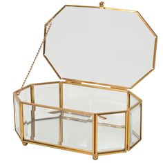 an octagonal glass box with gold chains hanging from the front and sides, on a white background