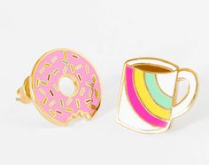 two rings with donuts on them are next to each other and one has a rainbow cup