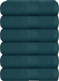 six dark green towels stacked on top of each other