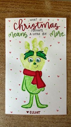 a handmade christmas card with an image of a cartoon character wearing a red scarf