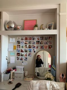 a woman taking a selfie in front of a mirror on top of a desk