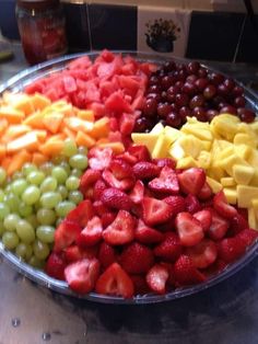 a platter filled with lots of different types of fruit