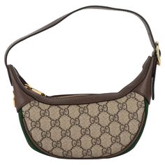 Gucci mini Ophidia half moon bag with gg classic canvas print, brown leather trim and gold tone hardware. Perfect exterior, minimum wear on interior. Adjustable shoulder strap drop 6”. Comes with original dustcover and box. Gucci Mini, Moon Bag, Printed Bags, Half Moon, Fashion Handbags, Leather Trims, Brown Leather, Shoulder Strap, Gold Tones