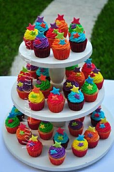 three tiered cupcake display with colorful frosting