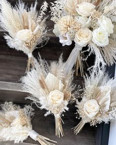 wedding bouquets with white flowers and feathers