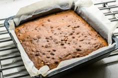 a cake in a pan sitting on top of a stove