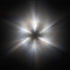 the sun's rays are shining brightly in the dark sky, creating a star like pattern