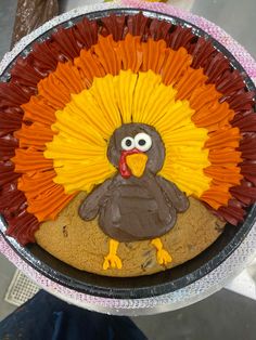 a decorated turkey cookie in a pan on a table