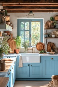 a kitchen with blue cabinets and wooden shelves