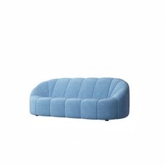 a blue couch sitting on top of a white floor