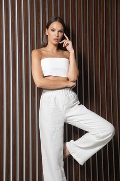 Full-length white 100% linen pants in white. High waist, drawstring waistband, wide legs with side-seam pockets. Regular fit   XS/S Waistband 65-75 cm/ 25,5-29,5 inches  Inside leg length 84cm/ 33 inches M/L  Waistband 75-85 cm/ 29,5-33,5 inches Inside leg length 76cm/33.5 inches Model's height: 173cm, 5' 8" wearing size XS/S Order preparing time: 1-3 working days Free worldwide delivery for all purchases  Delivery time: Europe: 2-5 working days USA: 2-4 working days Rest of the world: 2-5 worki Womens Trousers, Linen Trousers, Wide Legs, Linen Women, Drawstring Waistband, Linen Pants, Latvia, Trousers Women, Capri Pants