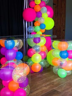 there are many balloons in the room