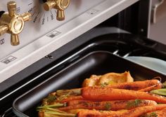 there are carrots and onions in the pan on the stove top burner oven