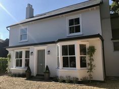 a white house with black trim and windows