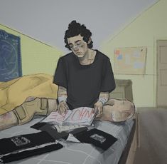 a man sitting on top of a bed next to another person laying down with an open book in front of him