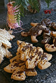 some cookies and other food on a rack next to a christmas tree ornament