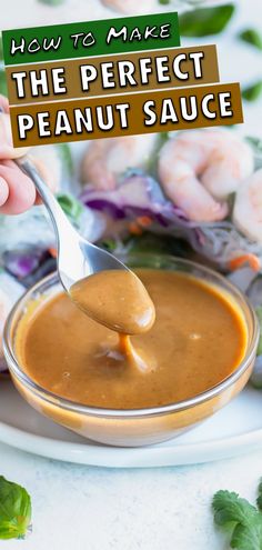 the perfect peanut sauce is being spooned into a bowl with shrimp in the background