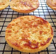 several small cakes cooling on a wire rack