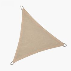 a beige triangle hanging on a white wall