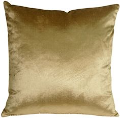 a gold pillow on a white background