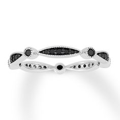 a black and white diamond ring on a white background