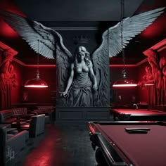 a pool table with a red light in front of it and an angel painting on the wall