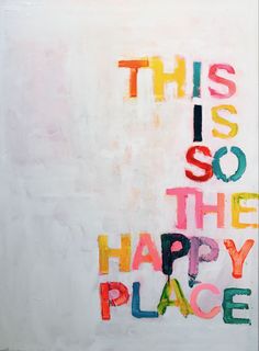 this is so the happy place written in multicolored letters on a white wall