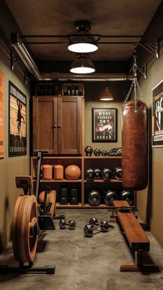 a home gym with an exercise equipment and punching bag on the floor, surrounded by wooden cabinets