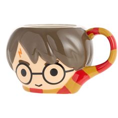 a harry potter mug with glasses on it's head and eyes painted on the side