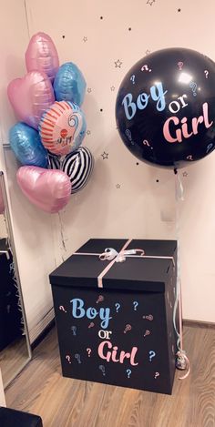 a boy or girl gift box and balloons