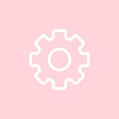 a white gear wheel on a pink background