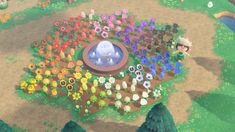 an animal crossing game with lots of flowers and plants in the middle of the field