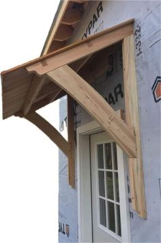 a wooden roof on top of a house under construction