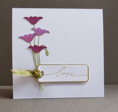 a white card with pink flowers on it