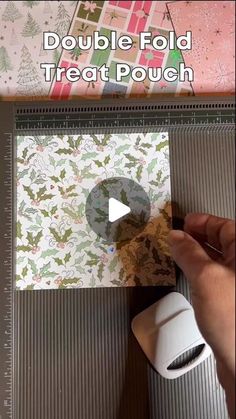 someone is making a paper christmas card with the words double fold treat pouch on it